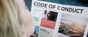 Woman reading CellMark's code of conduct.