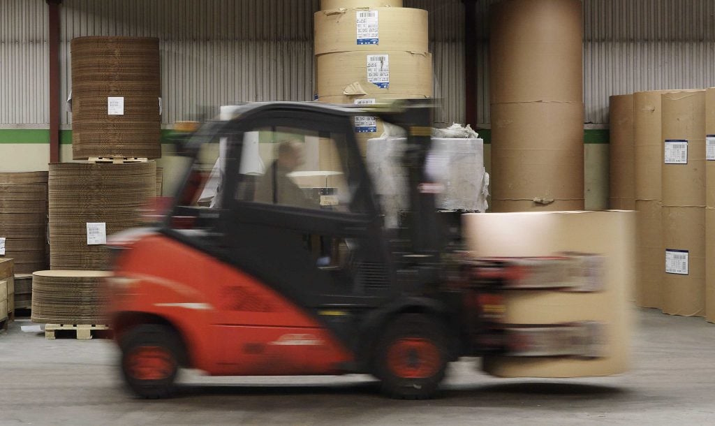 Truck lifting paper roll