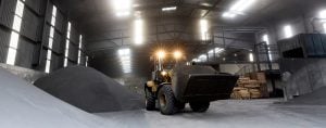 excavator in a warehouse