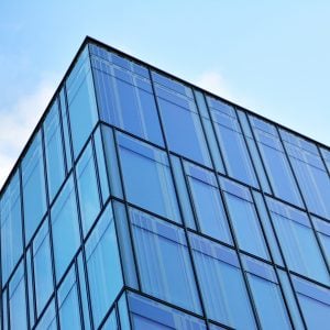 a glass building and blue sky