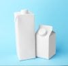 two simple milk cartons on color background
