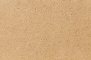 Pressed beige chipboard texture.
