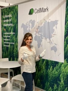 happy woman in exhibition booth