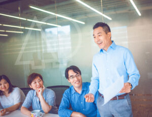 excited and motivated employees in a business meeting