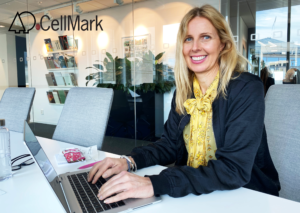 smiling happy woman working on a laptop