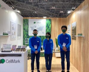 three cellmark employees in a exhibition booth