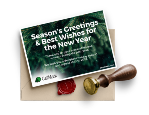 green seasons greetings card with brown envelope and red stamp